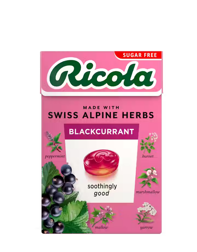 Pink sugar-free Ricola Blackcurrant herb drops box with botanical illustrations.