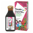 A bottle and box of Floradix Kids iron and vitamin formula for children, featuring two kids and various fruits on the packaging.