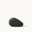A dark rectangular bar of Sea Magik Black Mud Soap with an embossed logo.