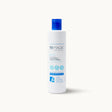 Tall white bottle of Sea Magik Hair Magic Conditioner with a blue cap and label.