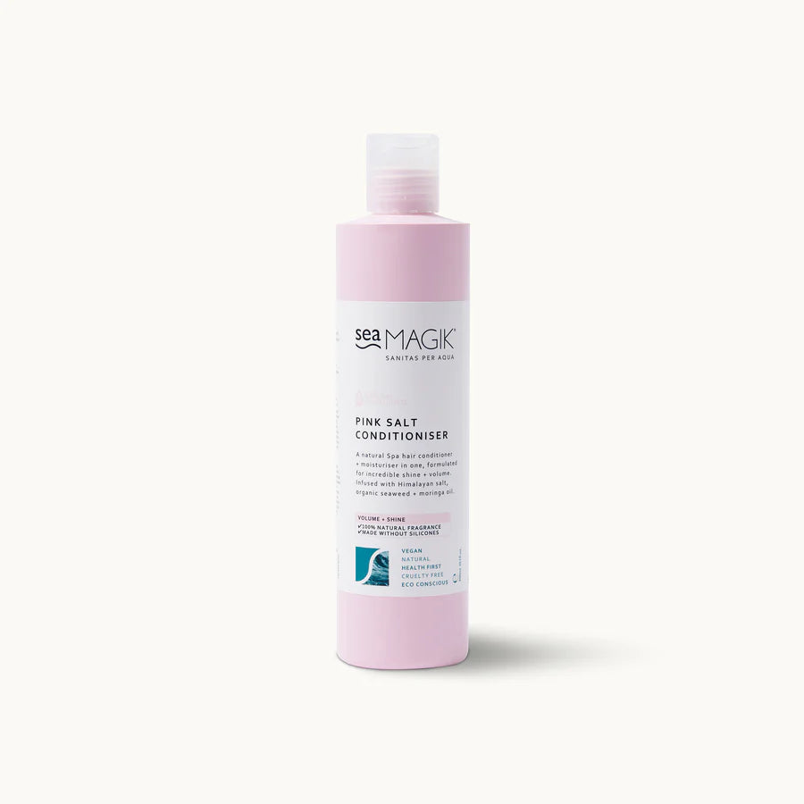 Tall pink bottle of Sea Magik Pink Salt Conditioner with a clear cap and white label.