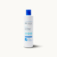 Tall white bottle of Sea Magik Silky Smooth Body Lotion with a blue dispenser cap and label.
