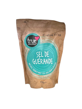 A 750g brown paper pouch of True Sel de Guérande (French Grey Sea Salt) with a turquoise circular label and white line art.