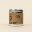 Small silver tin of St Eval Bergamot & Nettle candle featuring a brown kraft paper label.