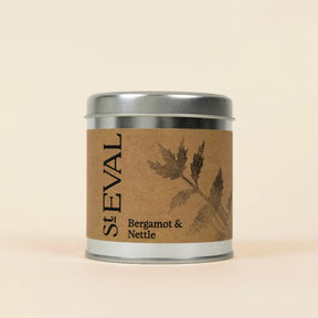 Small silver tin of St Eval Bergamot & Nettle candle featuring a brown kraft paper label.