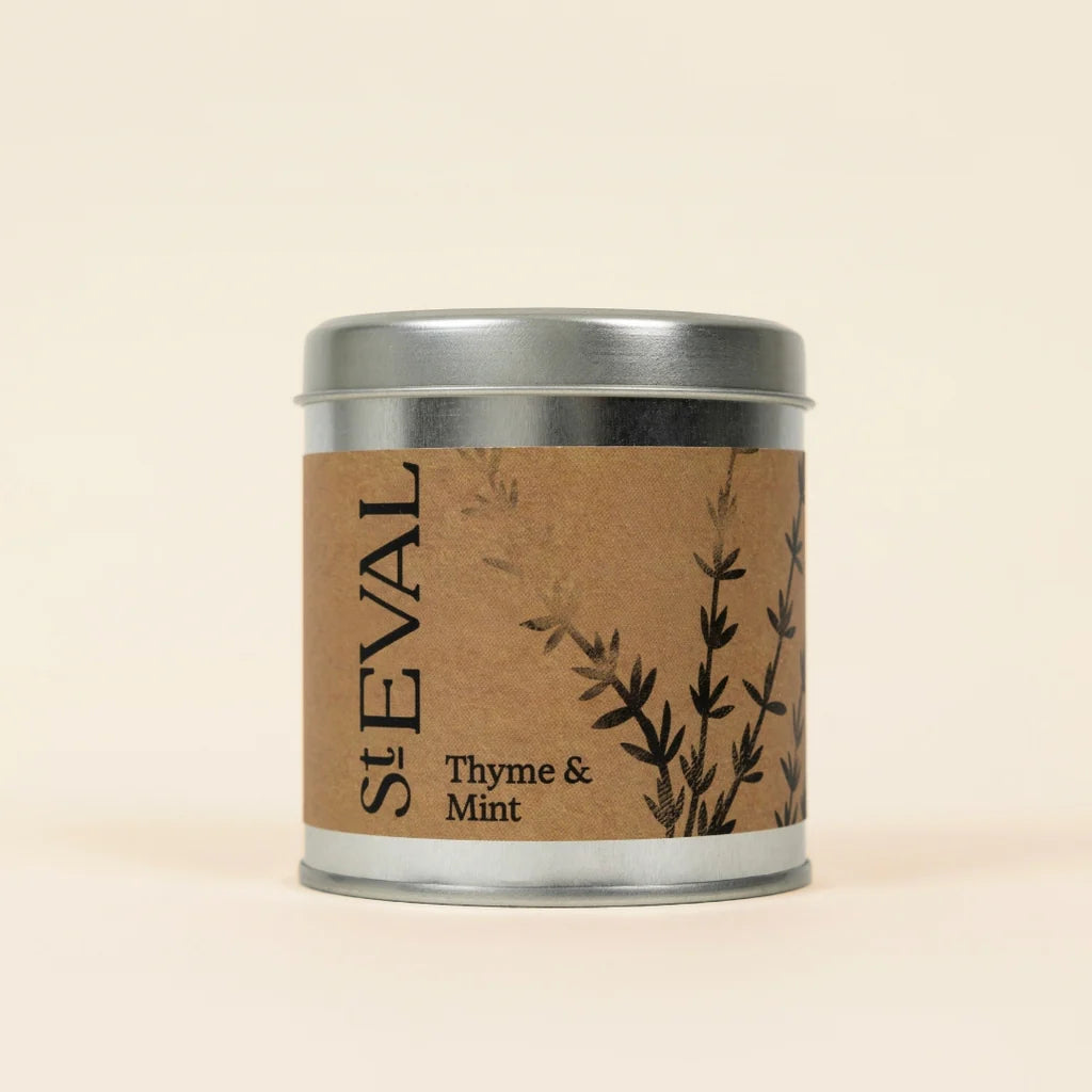 Small silver tin of St Eval Thyme & Mint candle featuring a brown kraft paper label.