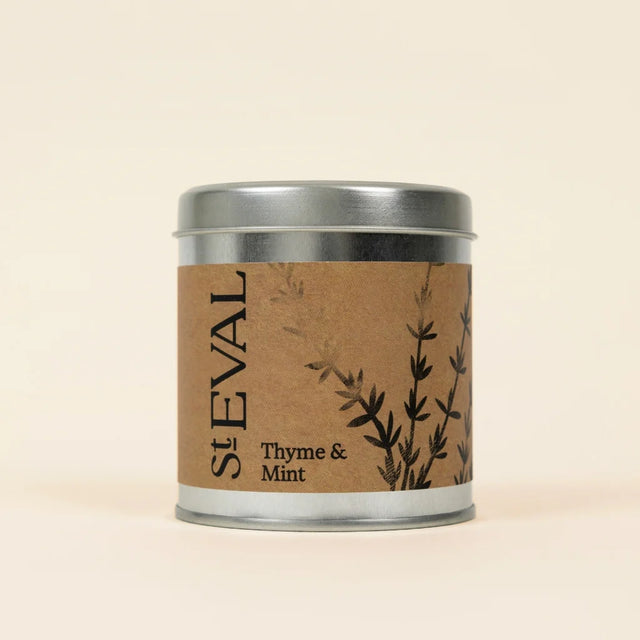 Small silver tin of St Eval Thyme & Mint candle featuring a brown kraft paper label.
