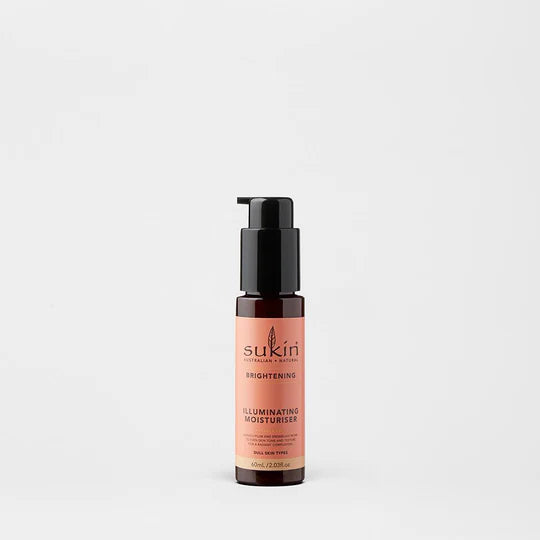 Sukin Brightening Illuminating Moisturiser in a dark amber pump bottle.