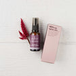 Sukin Purely Ageless Intensive Firming Serum surrounded by green botanical leaves.
