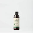 Sukin Signature Cleansing Oil in a dark amber bottle with cap.