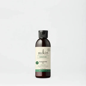 Sukin Signature Cleansing Oil in a dark amber bottle with cap.