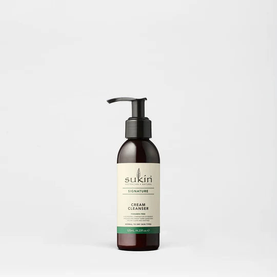 Sukin Signature Cream Cleanser in a dark pump bottle, paraben free.