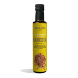 Tall dark glass bottle of Sun & Seed Cold Pressed Organic Flaxseed Oil featuring a bright yellow label with an illustration of flaxseeds at the bottom.