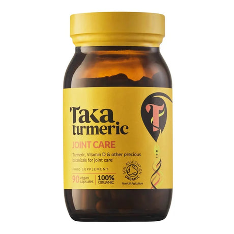A glass bottle of Taka Turmeric Joint Care food supplement with 90 vegan capsules.