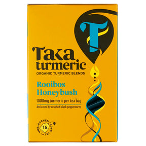 Yellow box of Taka Turmeric Rooibos Honeybush tea featuring a large stylized "T" and swirling patterns.