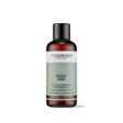 100ml amber glass bottle of Tisserand Black Seed oil with a sage green and white label and a black screw cap.