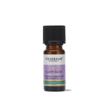A small amber glass bottle of Tisserand Clary Sage ethically harvested pure essential oil with a purple and white label and a black cap.