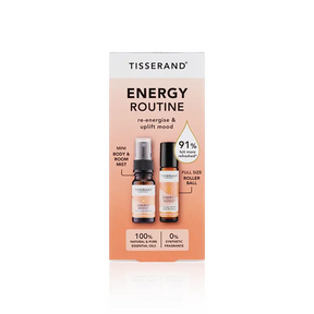 Tisserand Energy Routine set featuring a mini Energy Boost body and room mist and a full-size pulse point roller ball in a peach-colored box.