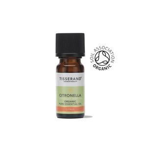 A small amber glass bottle of Tisserand Citronella organic pure essential oil with a light green and white label and a black cap.