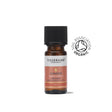 A small amber glass bottle of Tisserand Ginger organic pure essential oil with a terracotta and white label and a black cap.