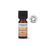 A small amber glass bottle of Tisserand Grapefruit organic pure essential oil with a peach and white label and a black cap.