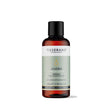100ml amber glass bottle of Tisserand Jojoba oil with a sage green and white label and a black screw cap.