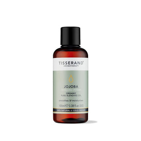 100ml amber glass bottle of Tisserand Jojoba oil with a sage green and white label and a black screw cap.