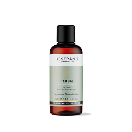 100ml amber glass bottle of Tisserand Jojoba oil with a sage green and white label and a black screw cap.