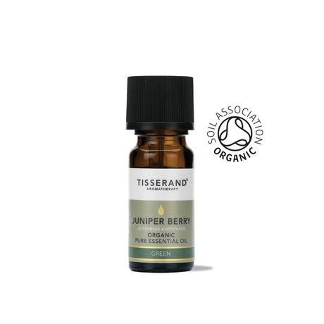 A small amber glass bottle of Tisserand Juniper Berry organic pure essential oil with a sage green and white label and a black cap.