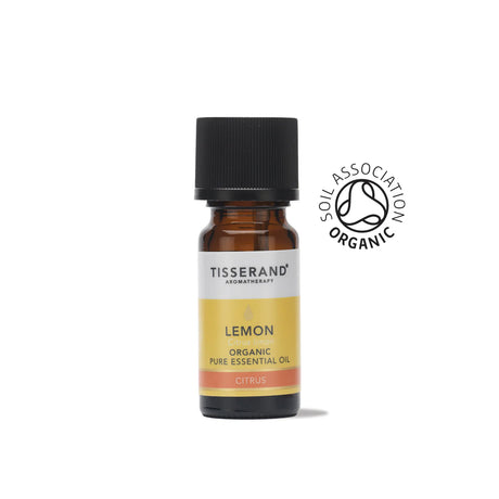 A small amber glass bottle of Tisserand Lemon organic pure essential oil with a yellow and white label and a black cap.