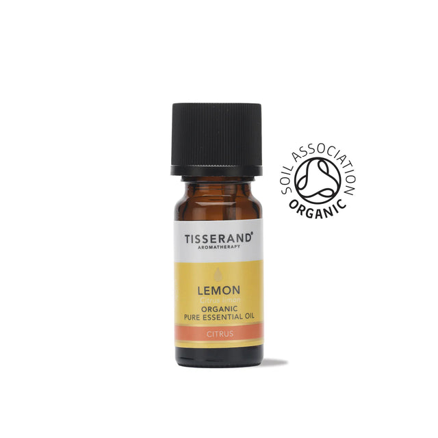 A small amber glass bottle of Tisserand Lemon organic pure essential oil with a yellow and white label and a black cap.