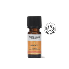 A small amber glass bottle of Tisserand Orange organic pure essential oil with an orange and white label and a black cap.