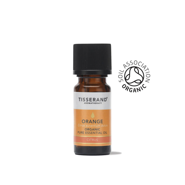 A small amber glass bottle of Tisserand Orange organic pure essential oil with an orange and white label and a black cap.