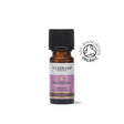 A small amber glass bottle of Tisserand Patchouli organic pure essential oil with a purple and white label and a black cap.