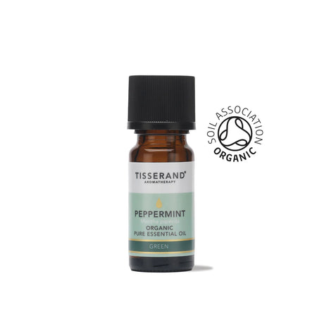 A small amber glass bottle of Tisserand Peppermint organic pure essential oil with a light green and white label and a black cap.