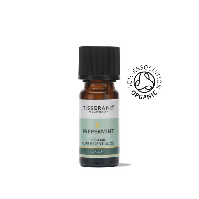 A small amber glass bottle of Tisserand Peppermint organic pure essential oil with a light green and white label and a black cap.