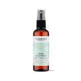 100ml amber spray bottle of Tisserand Total De-Stress mist with a light teal and white label.