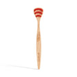 Wooden toothbrush with red bristles, featuring a carved leaf design on the handle. Branding text "georganics" is visible, conveying an eco-friendly vibe.