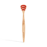 Wooden toothbrush with red bristles, featuring a carved leaf design on the handle. Branding text "georganics" is visible, conveying an eco-friendly vibe.