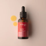 A 45ml amber glass bottle of Trilogy Certified Organic Rosehip Oil with a black dropper cap and a signature red label.