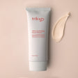 A 75ml tube of Trilogy Ultra Hydrating Face Cream in minimalist white packaging with red text, featuring Rosapene, manuka honey, and lavender.