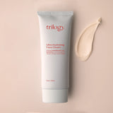 A 75ml tube of Trilogy Ultra Hydrating Face Cream in minimalist white packaging with red text, featuring Rosapene, manuka honey, and lavender.