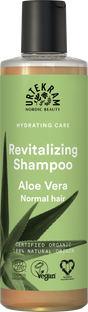 A bottle of Urtekram Aloe Vera Revitalizing Shampoo for normal hair, with a light green label featuring an aloe leaf and organic/vegan logos.