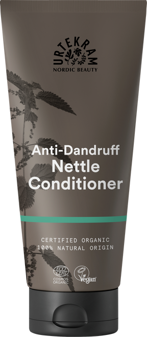 A brown tube of Urtekram Anti-Dandruff Nettle Conditioner featuring a nettle plant illustration, a teal stripe, and organic and vegan logos.