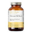 A dark amber glass bottle of Udo's Choice Ultimate Oil Blend food supplement capsules with a white and yellow label and a silver metal cap.