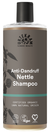 Grey bottle of Urtekram Anti-Dandruff Nettle Shampoo featuring a black cap and certified organic natural labels.