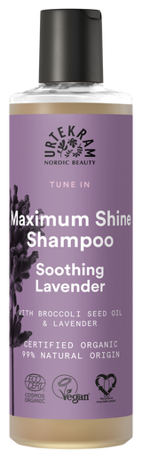 A bottle of Urtekram "Tune In" Maximum Shine Shampoo with Soothing Lavender, featuring a purple label with lavender illustrations and organic/vegan certification logos.