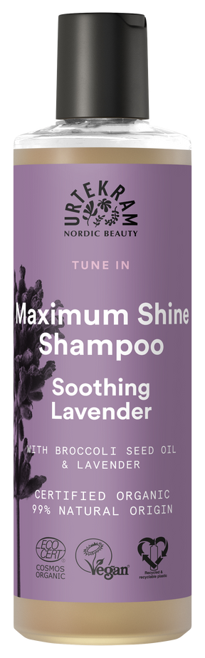 A bottle of Urtekram "Tune In" Maximum Shine Shampoo with Soothing Lavender, featuring a purple label with lavender illustrations and organic/vegan certification logos.