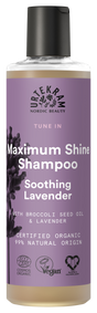 A bottle of Urtekram "Tune In" Maximum Shine Shampoo with Soothing Lavender, featuring a purple label with lavender illustrations and organic/vegan certification logos.