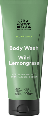Green tube of Urtekram Blown Away Wild Lemongrass Body Wash with black cap.